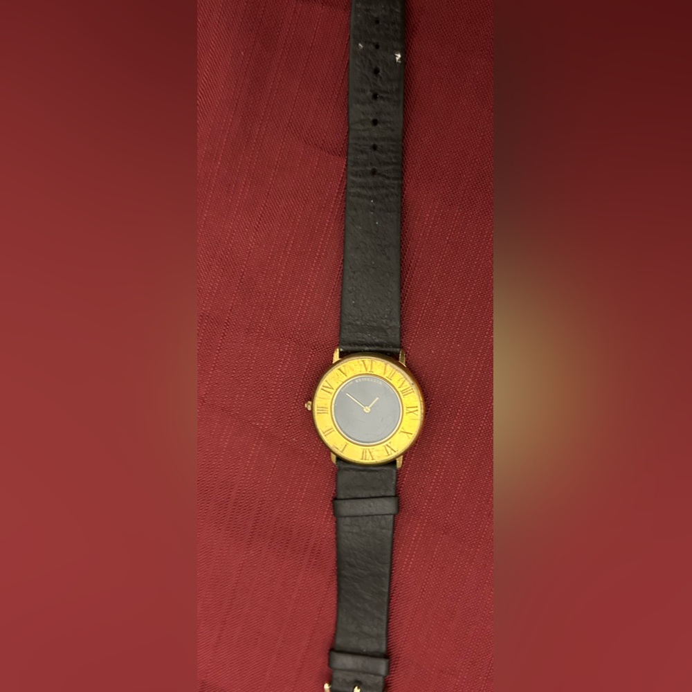Gold and Black Watch with Roman Numerals